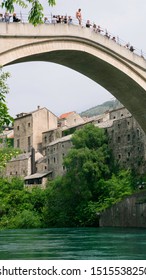 Mostar / Bosnia & Herzegovina - April 2019: Diver Prepares To Jump From Mostar Bridge (Stari Most) Dive Jump.