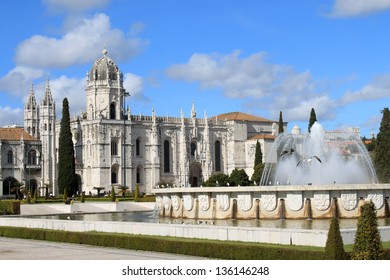The Mosteiro or monastery dos Jeronimos displaying Manueline architecture with fountain from Praca do Imperio gardens, Portugal
