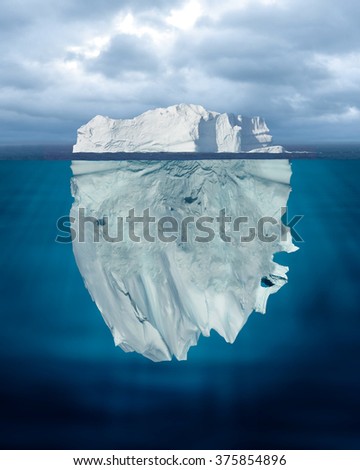 Mostly Underwater Iceberg Floating in Ocean