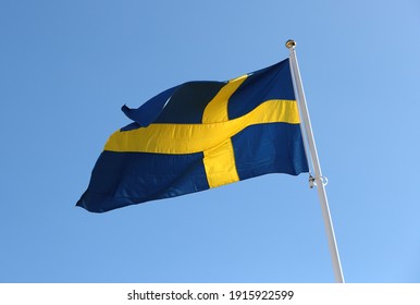 MOTALA, SWEDEN- 22 MARCH 2019:
The Swedish flag against a blue sky.
Photo Jeppe Gustafsson