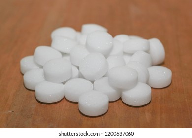 Mothballs with wood background. Camphor