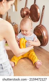 A Mother With A 1-year-old Child Is Preparing A Festive Salad In The Kitchen For The Arrival Of Her Father, A Series Of Photos From Everyday Life In A Real Interior.