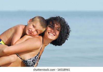 Mother and 4 years son enjoying on  summer vacation on beach - Shutterstock ID 16518961