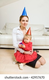 mother and adorable baby celebrating birthday or New Year