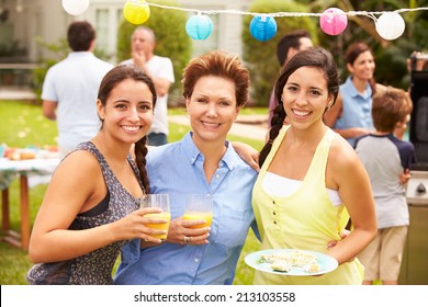 Mother With Adult Daughters Enjoying Party In Garden