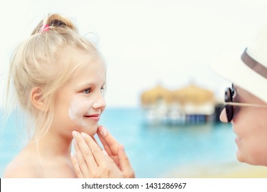 Mother Applying Sunscreen Protection Creme On Cute Little Toddler Boy Face. Mom Using Sunblocking Lotion To Protect Baby From Sun During Summer Sea Vacation. Children Healthcare At Travel Time