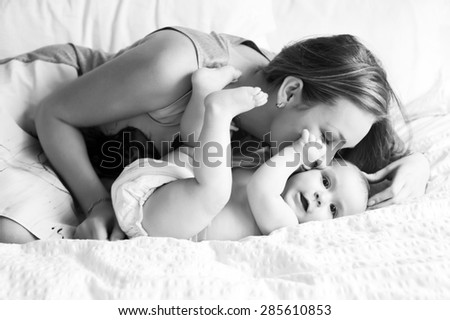 Similar – Image, Stock Photo happy mother and baby playing at home in bedroom