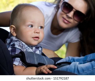 Mother And  Baby In The Back Seat Of A Car On A Road Trip