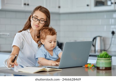 Mother, baby and book with laptop for remote work at kitchen for reading, ideas or editing in family home. Woman, infant and computer for creativity in notes, freelance or thinking for media company - Powered by Shutterstock