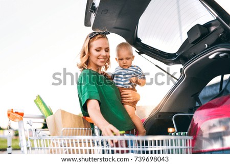 Similar – Foto Bild Kleiner Junge setzt kleines Papierschiff ins Wasser