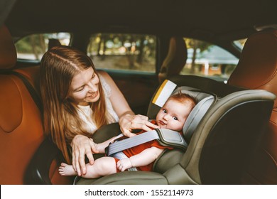 Mother And Baby In Car Family Lifestyle Kid Sitting In Safety Car Seat Vacations Child Transportation Rear-facing 