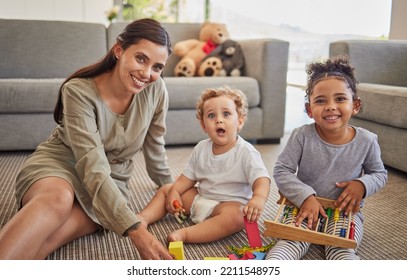 Mother, Baby And Child On Carpet For Education, Learning And Teaching In Their Living Room Home With Happy Portrait. Young Mom From Mexico With Kids Play Time, Mindset Growth Development With Puzzle