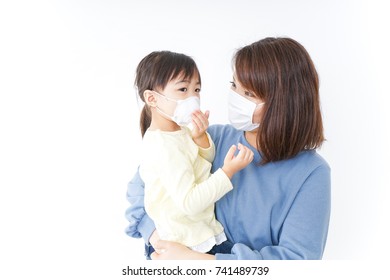 Mother And Baby With Cold Prophylaxis Mask