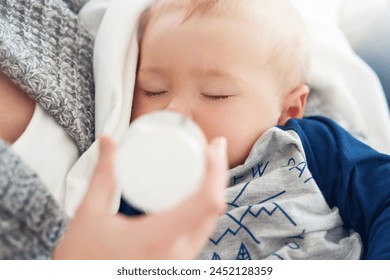 Mother, baby and feeding with maternity, home and love for child development and milk bottle. Mom, kid and sleeping with growth, motherhood and parenting with family house and bonding in bedroom - Powered by Shutterstock