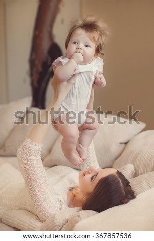 Similar – Image, Stock Photo happy mother and 9 month old baby in matching pajamas
