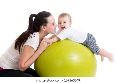 mother and baby having fun with gymnastic ball