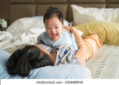 Mother And Baby Having Fun On Their Tummy Time