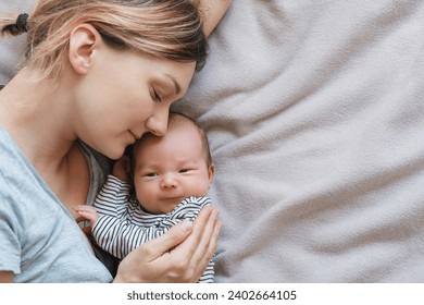 Mother and baby. Loving mom spending time with her little 2 weeks old child at home. Image of bonding mother and baby, healthy physical and mental development of child, happy maternity and family. - Powered by Shutterstock