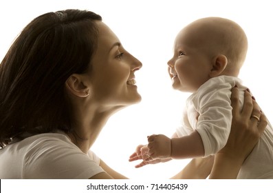 Mother And Baby, Mom Looking To Newborn Child Face To Face, Happy Kid Six Months Old