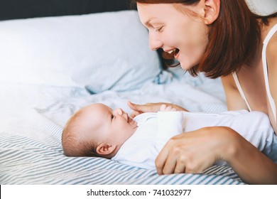 Mother and baby. Mom spend time with her little child at home. Image of happy maternity and family.
