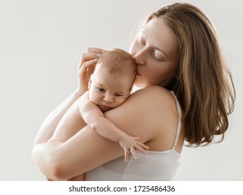 Mother with baby newborn family studio clean healthy skin care love