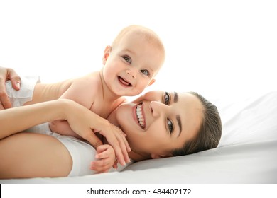 Mother And Baby On Bed