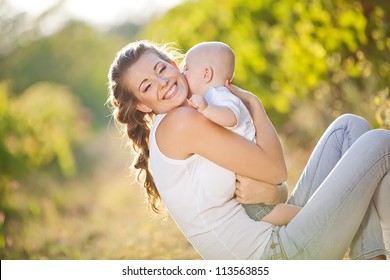Mother And Baby In Park Portrait