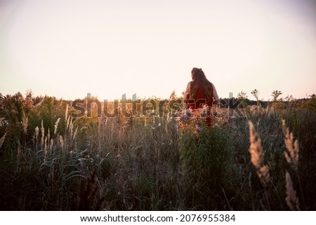 Similar – Image, Stock Photo Young woman looking at the sunset.