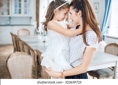 Mother And Baby Relaxing In A Stylish Interior