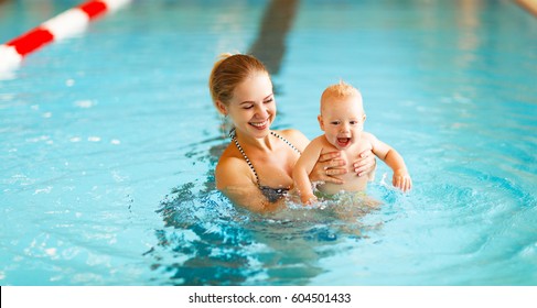 Mother and baby swim  in the pool