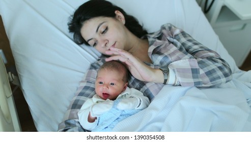 Mother and baby together after birth in first day of life - Shutterstock ID 1390354508