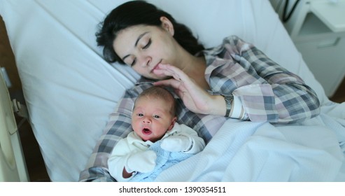 Mother and baby together after birth in first day of life - Shutterstock ID 1390354511