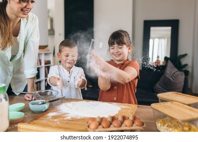Mother Baking With Their Children At Home
