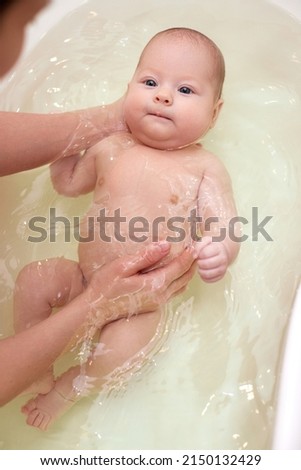 Similar – Newborn in the bathtub