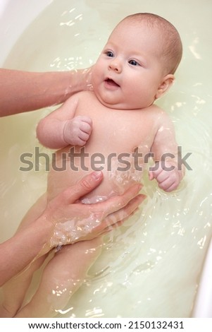 Similar – Newborn in the bathtub