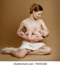 Mother breast feeding her infant