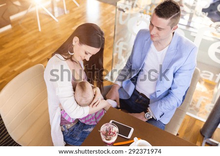 Similar – Image, Stock Photo young mother breast feeding her baby girl outdoors in a park