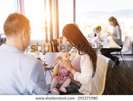 Similar – Image, Stock Photo young mother breast feeding her baby girl outdoors in a park