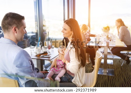 Similar – Image, Stock Photo young mother breast feeding her baby girl outdoors in a park