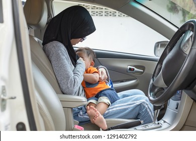 Mother Breastfeeding Child In A Car, Public Breastfeeding Concept.