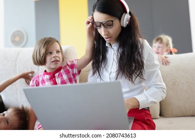 Mother Busy With Work On Laptop From Home Deadline To Do