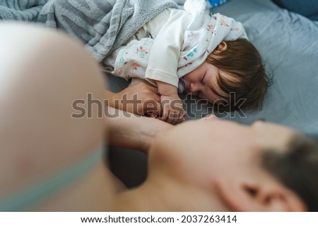 Similar – Image, Stock Photo Man reading with wife and son sleeping