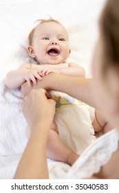 Mother Changing Baby Nappy