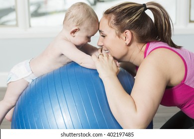 A Mother with child boy doing fitness exercises - Powered by Shutterstock