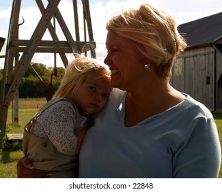 Mother and child by windmill