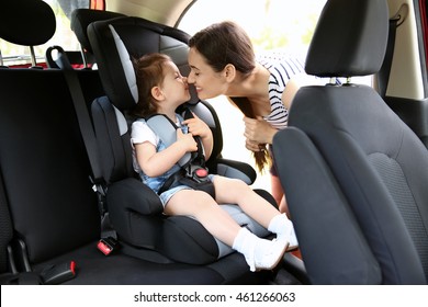 Mother and child in car. Safety driving concept