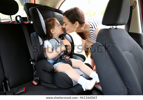 Mother and child\
in car. Safety driving\
concept