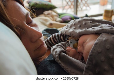 Mother, Child And Dog Sleeping At Home