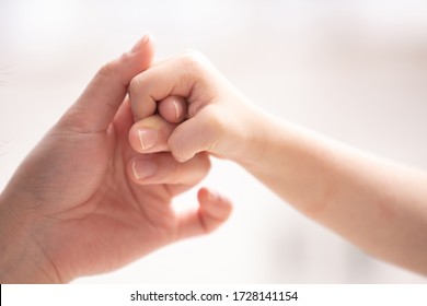 Mother And Child Holding Hands