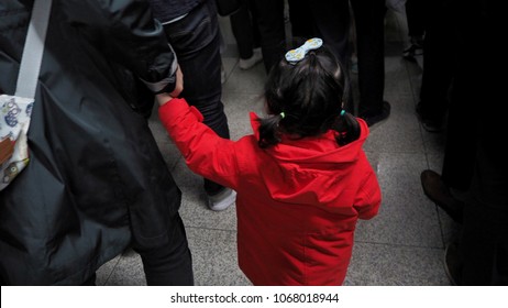 Mother And Child Holding Hands Walking on The Subway.